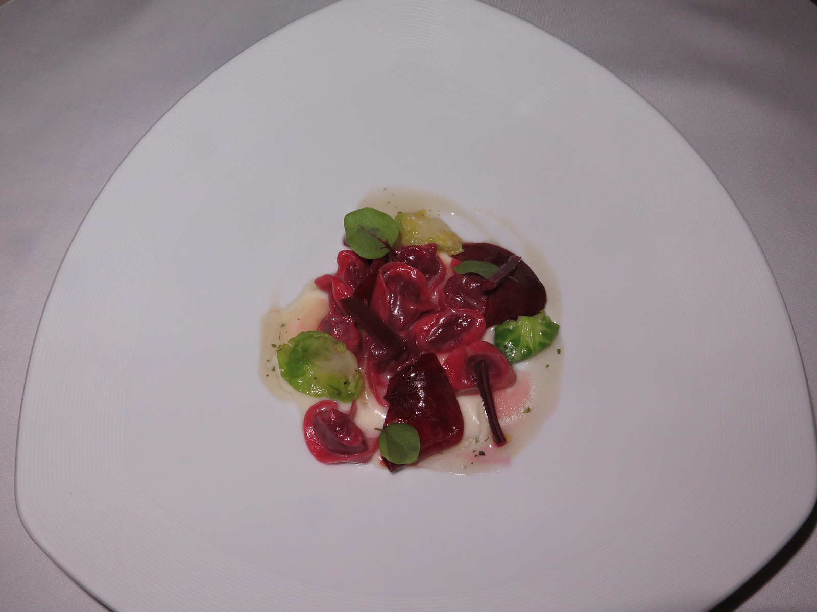 “Beetroot and red cabbage tortellini with parmesan cream and katsuobushi infusion”